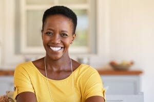 African woman looking at camera Jackie viatical settlement