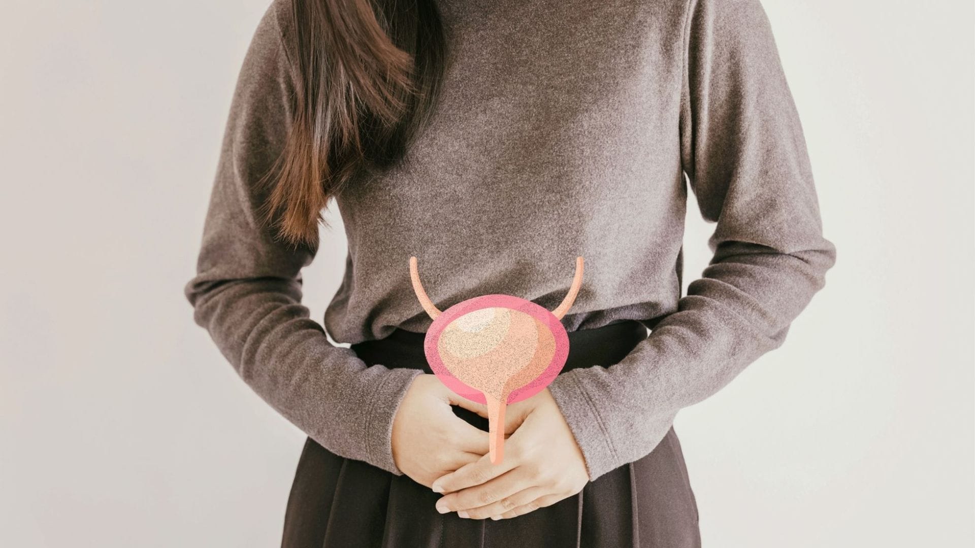 Person holding a graphic of a bladder, symbolizing the discussion on Insurance Coverage and Its Role in Bladder Treatment Costs.